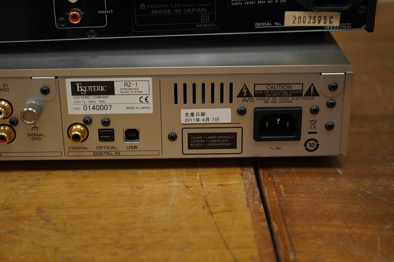 An Esoteric RZ-1 Integrated Music System, amplifier SACD/CD player, together with a Hitachi FT-5500 AM/FM stereo tuner, plus cables.